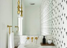Gold-faucets-and-marble-sink-make-a-big-impact-in-the-small-powder-room-217x155
