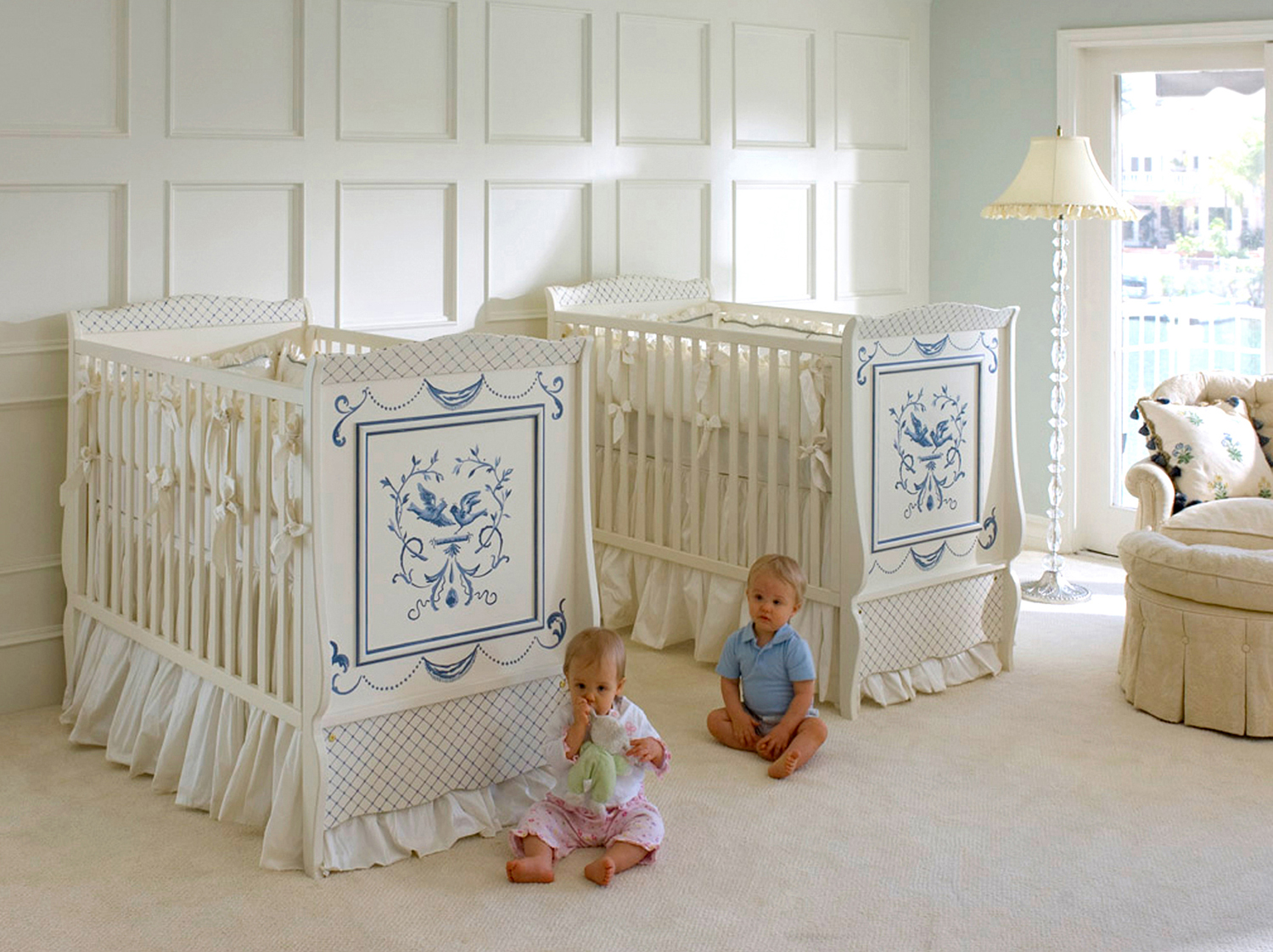 High cribs in a sunny twin nursery