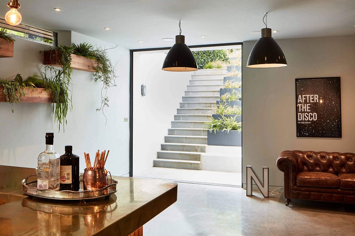 Home-bar-with-wall-mounted-wooden-planters-and-industrial-lighting