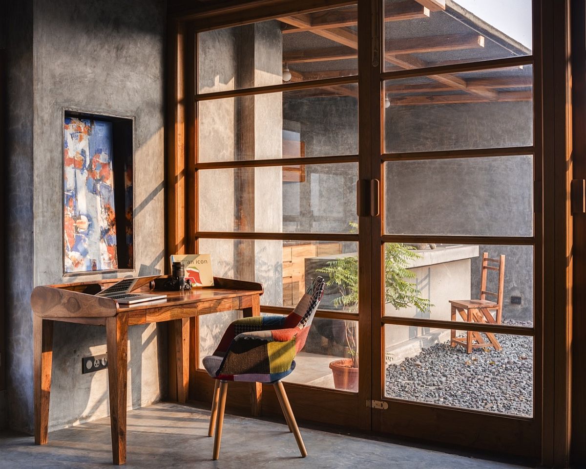 Home library and workspace on the top level connected with the terrace outside