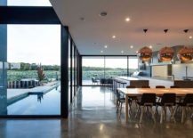 Kitchen-and-dining-area-of-sleek-modern-home-in-Victoria-217x155