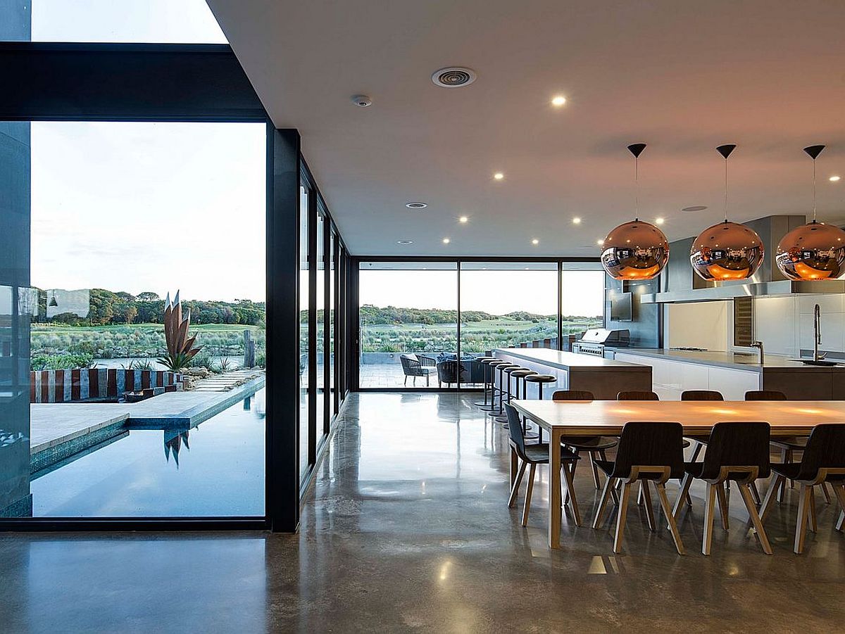 Kitchen and dining area of sleek, modern home in Victoria