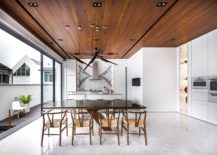Kitchen-and-dining-space-in-white-with-wooden-ceiling-217x155