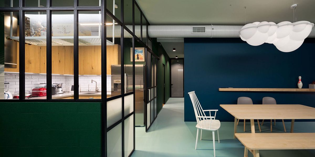 Kitchen with glass walls allows light to filter through easily