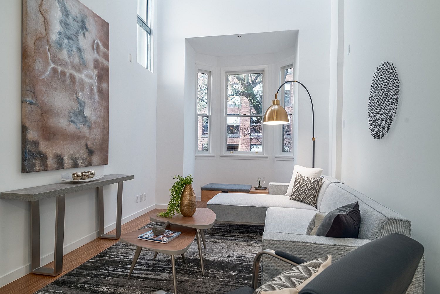 Light-filled living room of Vancouver loft with high ceiling