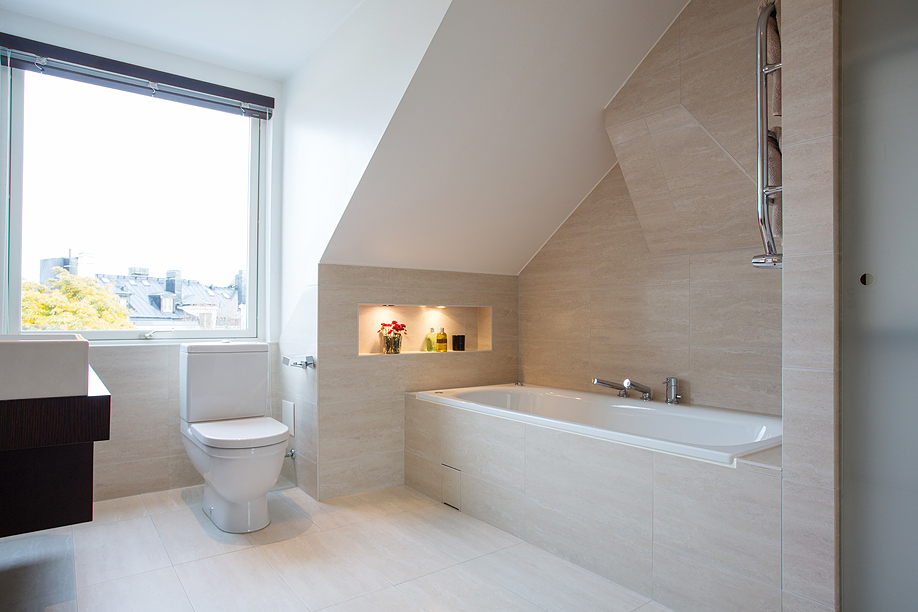 Lovely attic bathroom with a grand window