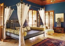 Metallic-four-poster-bed-in-a-bohemian-bedroom-217x155