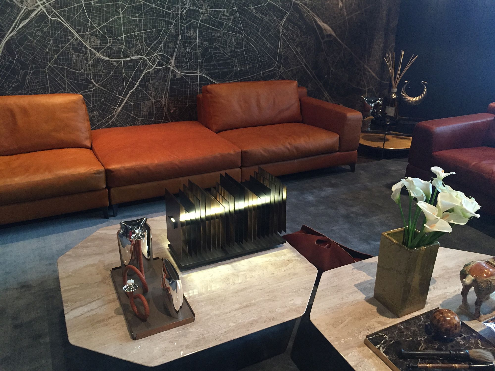 Octogonal coffee tables coupled with classy leather sofas in the living room