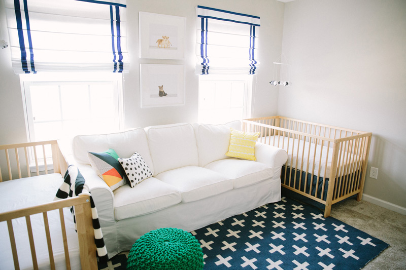 Open-and-spacious-nursery-with-sailor-blue-drop-down-curtains-