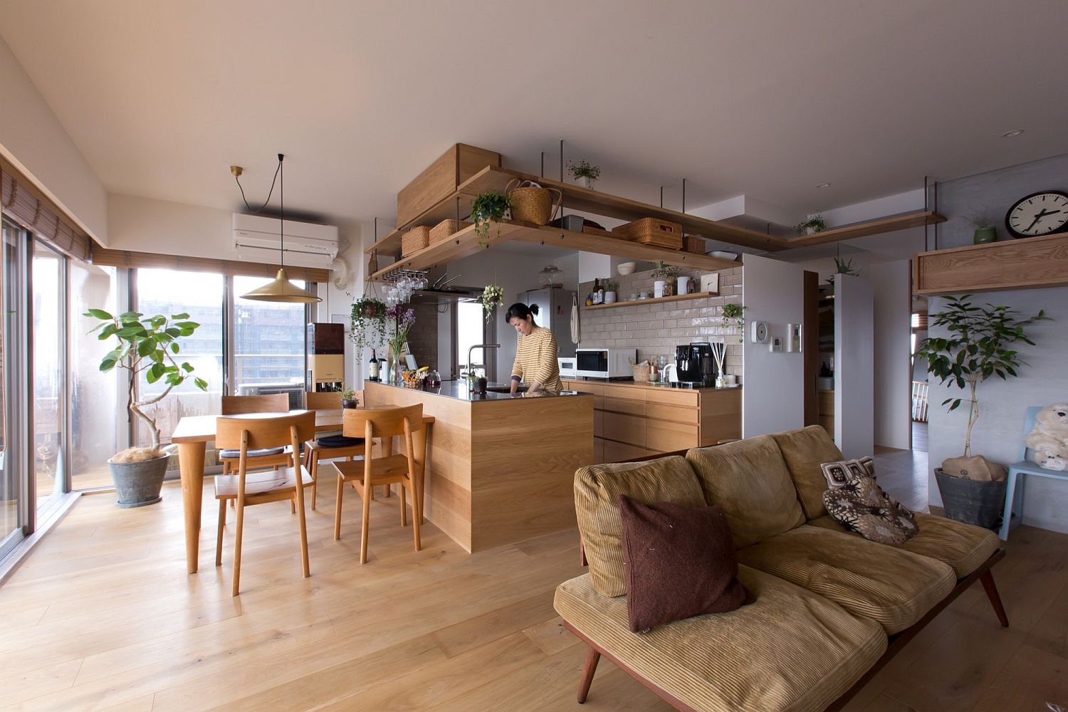 Open-living-area-with-dining-and-corner-kitchen-inside-the-Japanese-home
