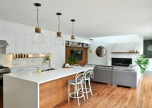 Open-living-area-with-kitchen-in-white-and-smart-pendant-lights-217x155