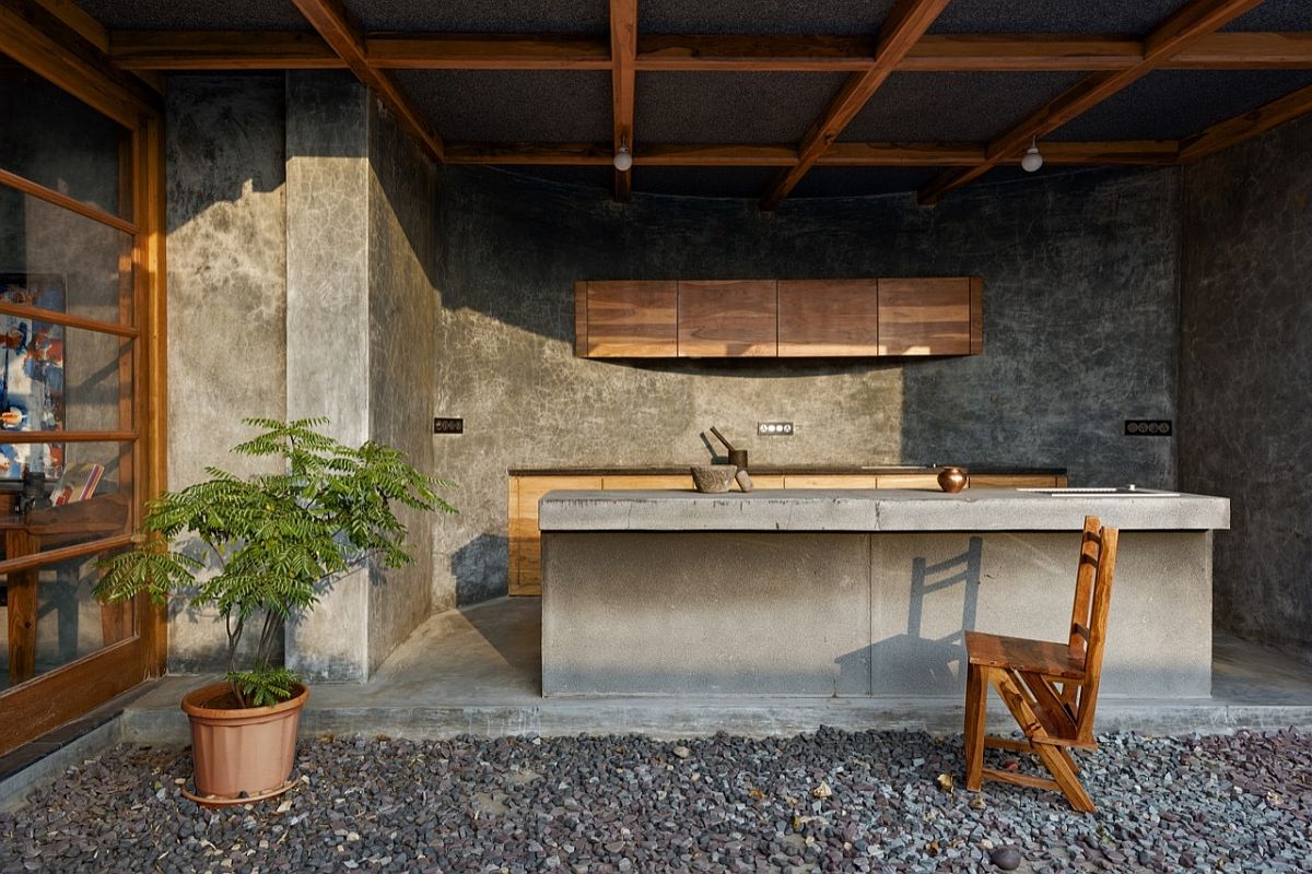 Open pantry overlooks the terrace garden filled with gravel path