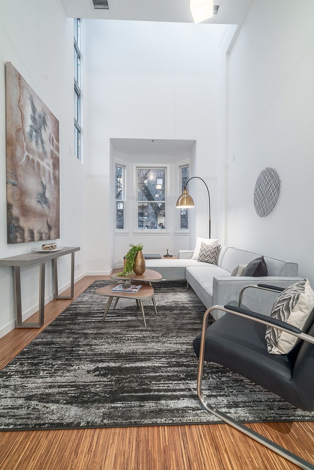 Original Bay Windows bring classic charm to the contemporary living space inside the Vancouver loft