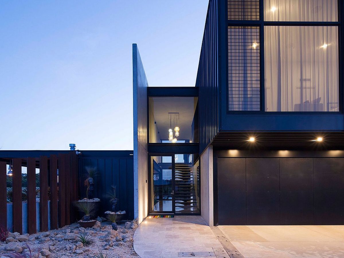 Pendant light illuminating the stiarway of the contemporary home