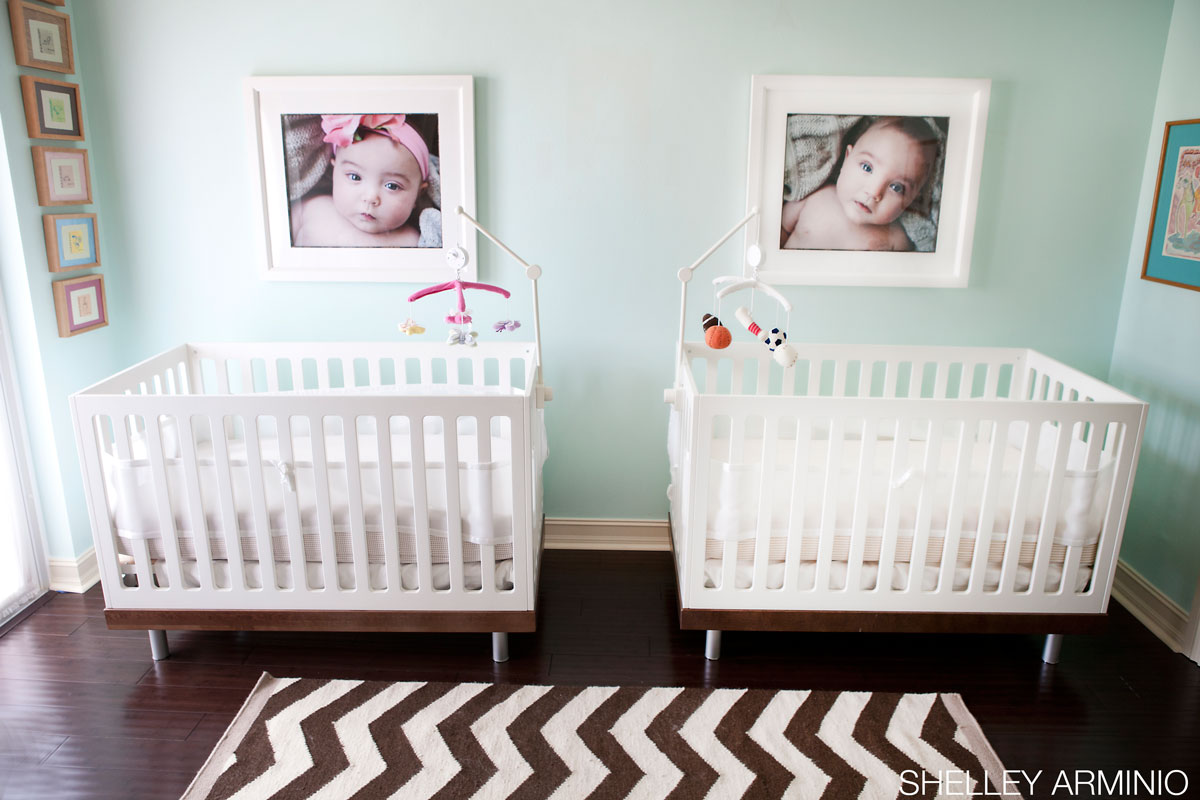 Photographs above the twin cribs