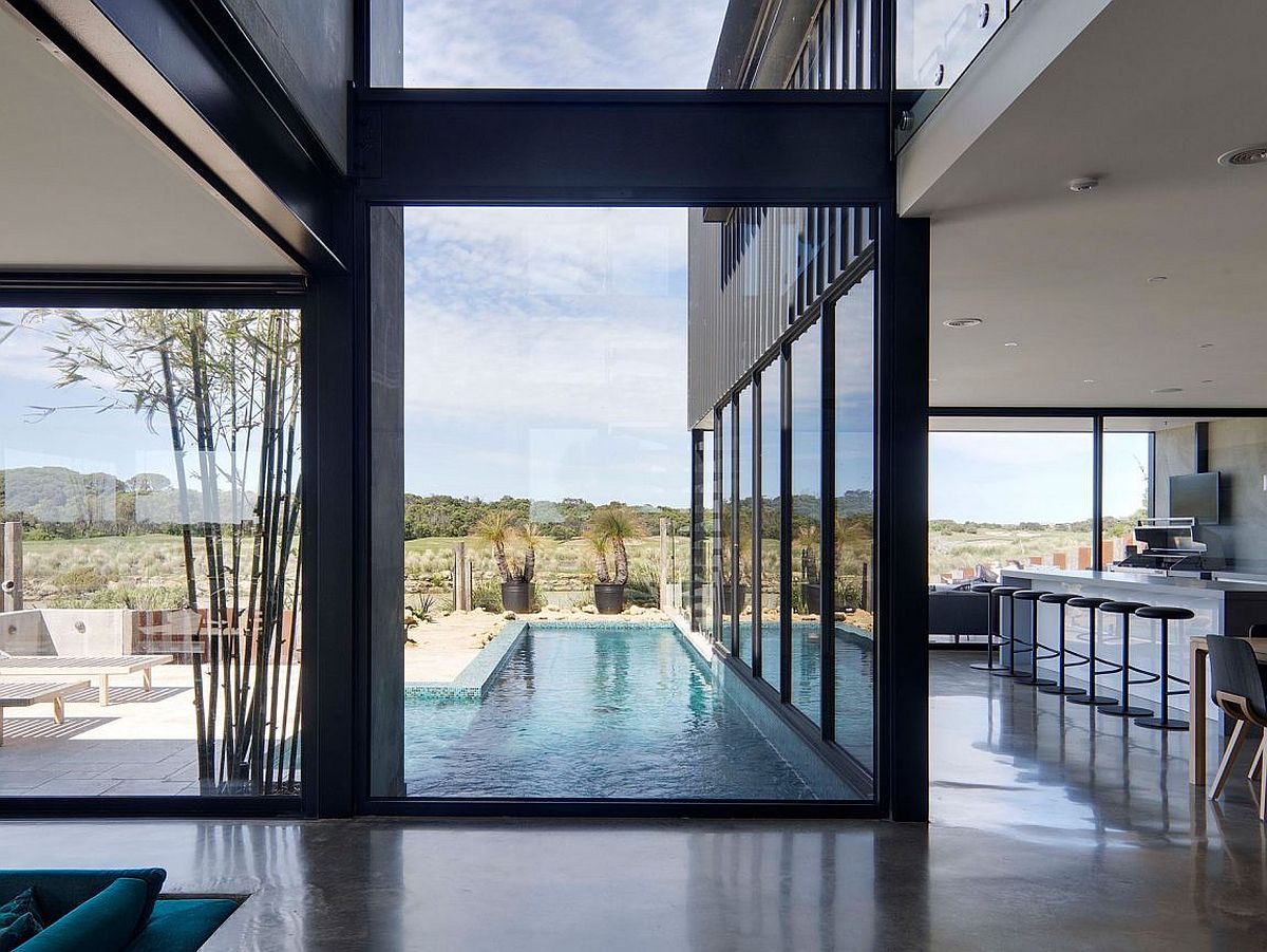 Pool-and-outdoor-sitting-area-of-the-home-connected-with-the-kitchen-visually