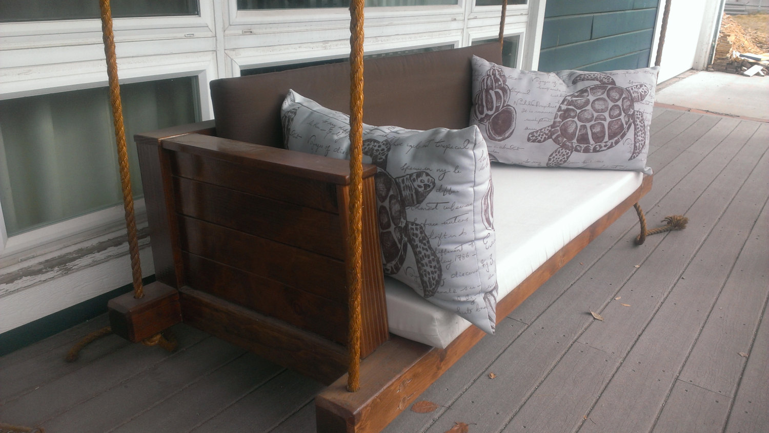 Rustic barn styled porch swing