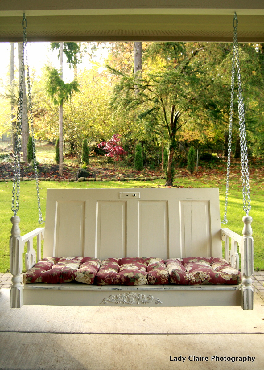 Simple white porch with contrasting thin red pillows