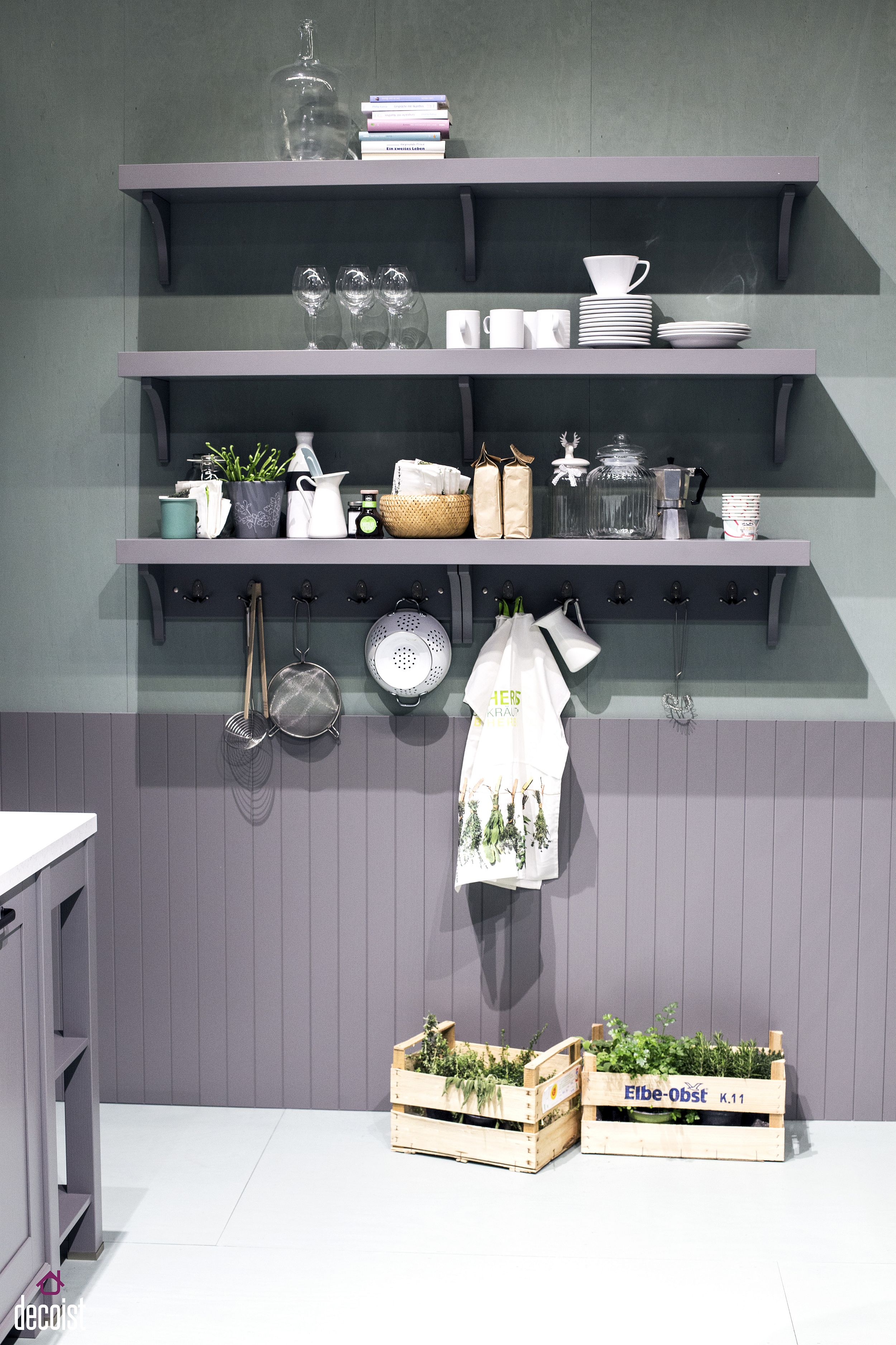 Slim floating shelves in gray create a smart and space-savvy kitchen display