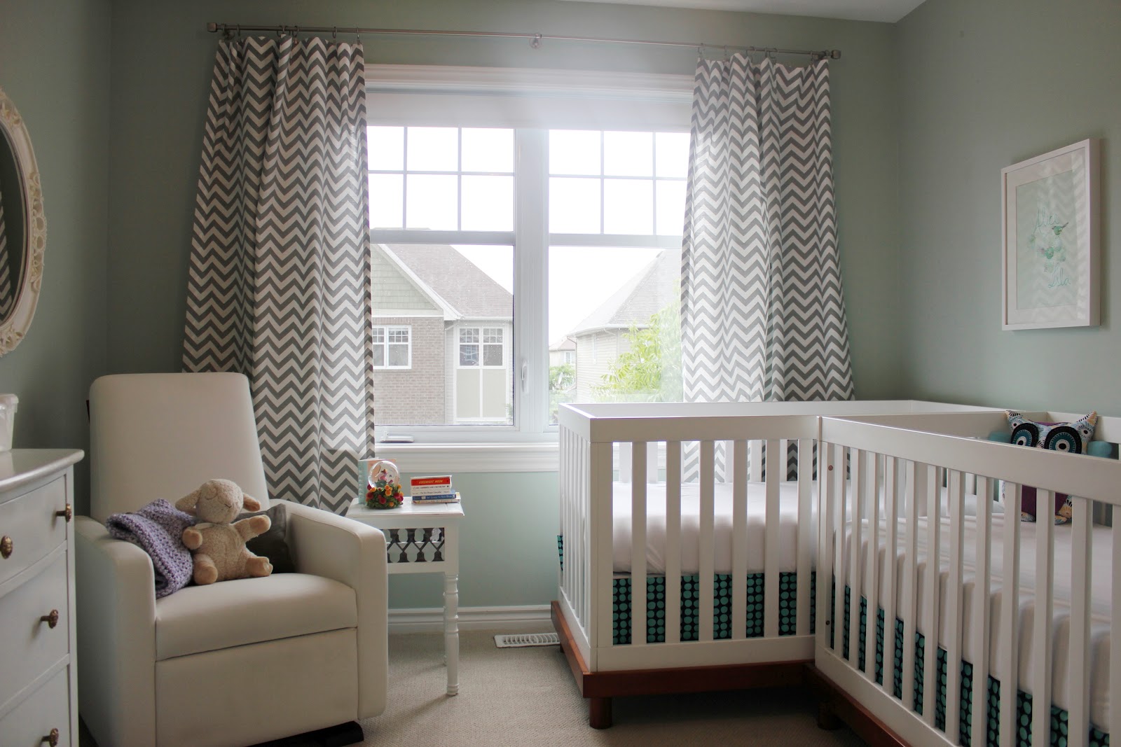 twin bed and crib in small room