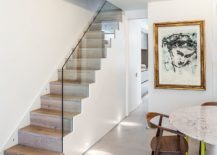Small-and-stylish-staircase-with-glass-railing-and-hidden-storage-217x155