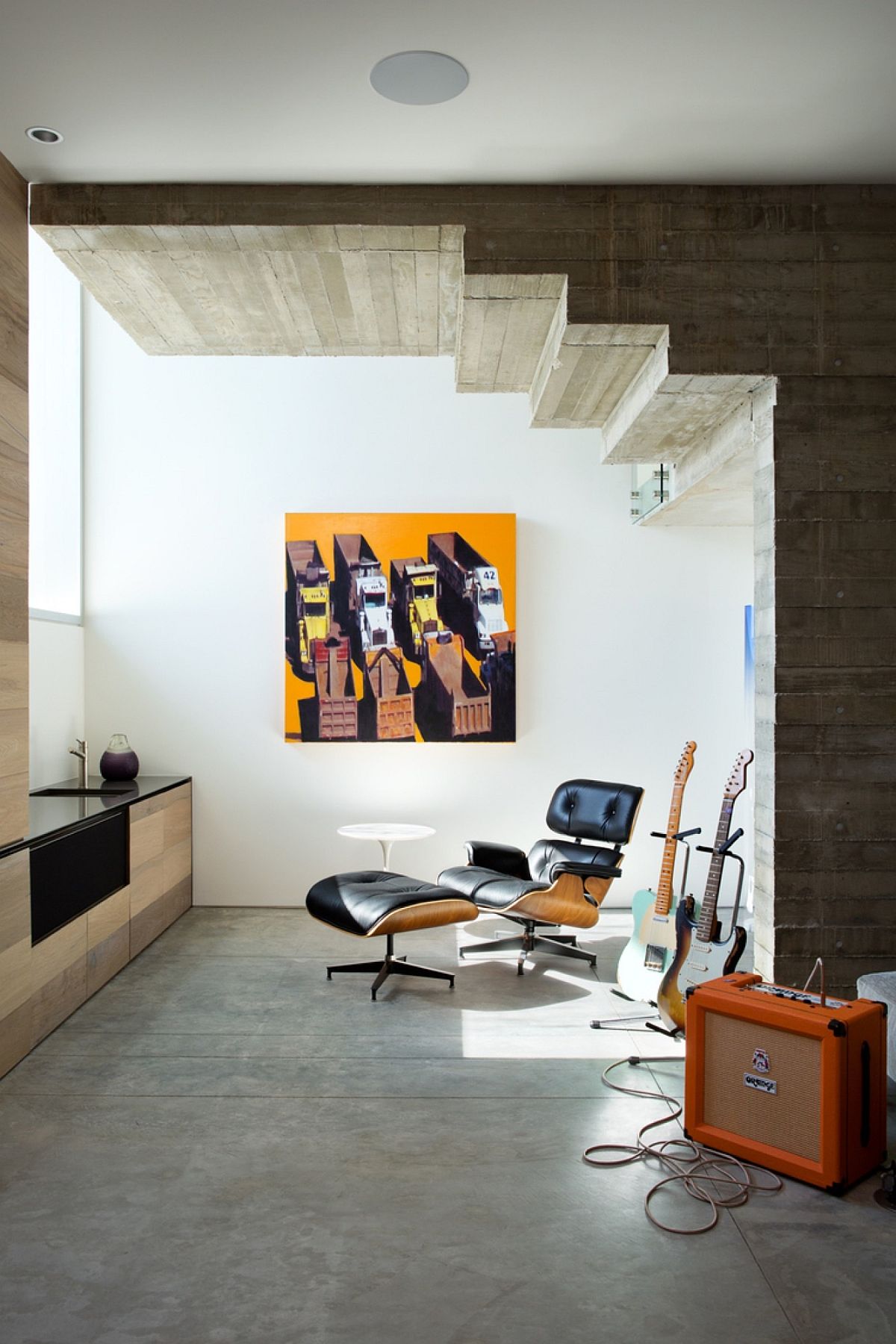 Small-recreational-and-relaxation-space-under-the-stairway-with-the-Eames-Lounger