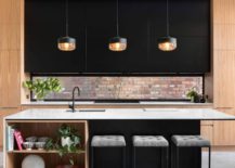 Small-window-above-the-the-kitchen-counter-brings-the-brick-wall-aesthetic-indoors-217x155