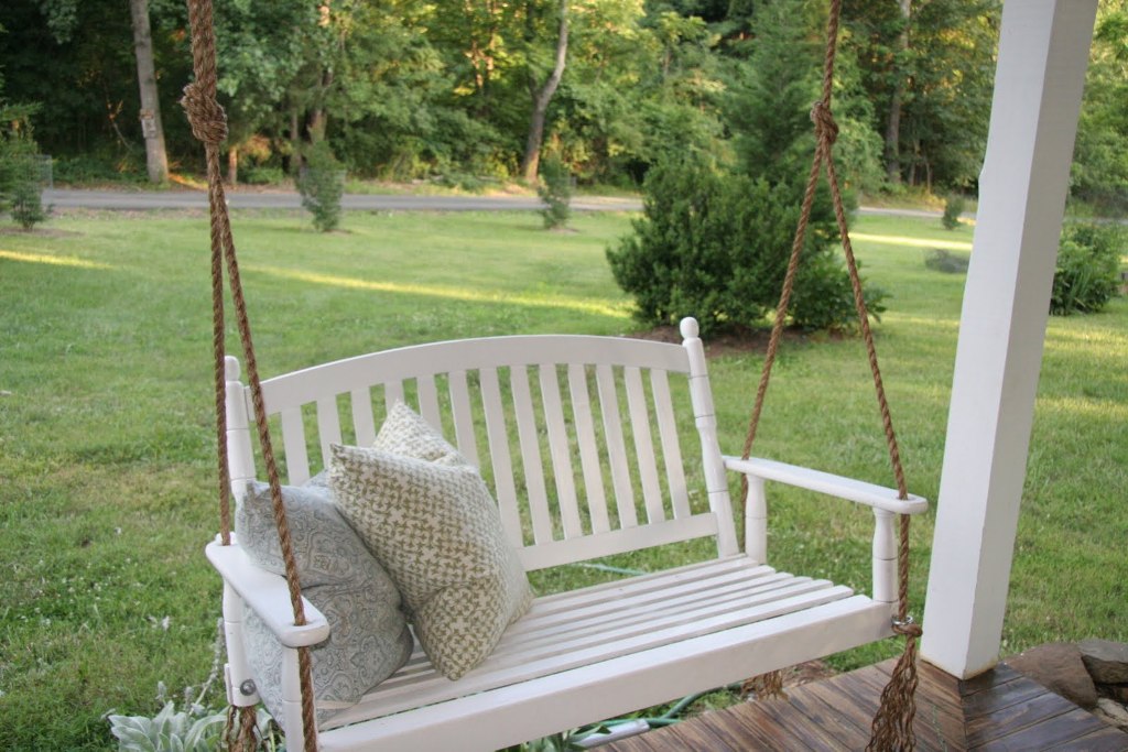 White porch swing on sale with rope