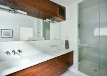 Top-wooden-cabinet-in-the-bathroom-adds-textural-beauty-to-the-bathroom-along-with-the-vanity-217x155