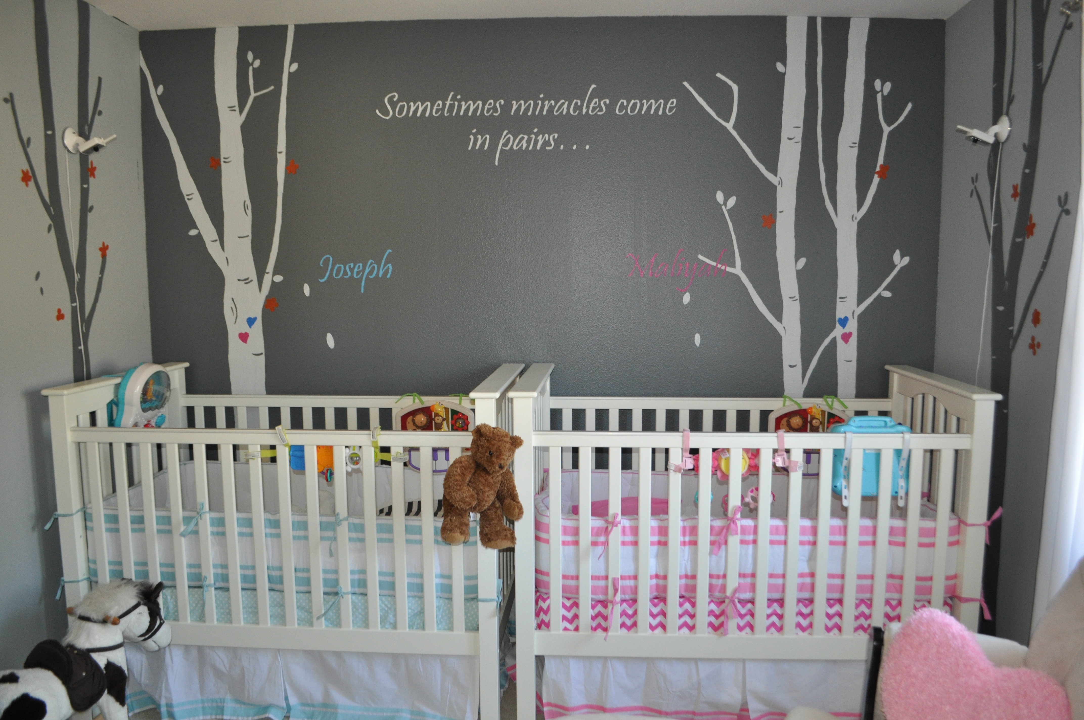 Traditional blue and pink combination against a marvelously decorated wall