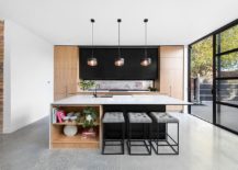 Trio-of-pendants-light-up-the-dashing-and-open-kitchen-island-217x155
