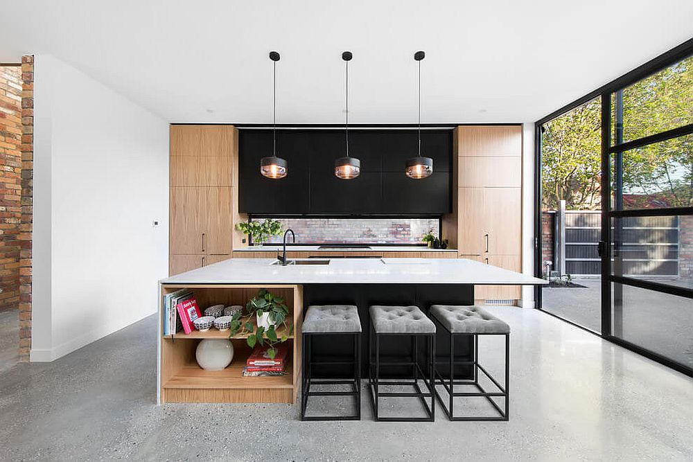 Trio of pendants light up the dashing and open kitchen island