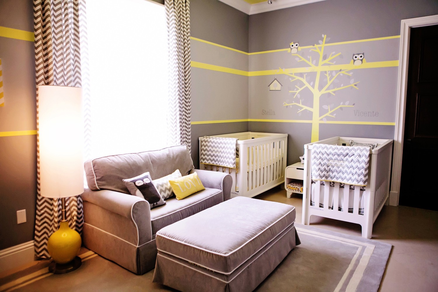 Twin-nursery-wth-a-yellow-wall-decoration-and-neutral-interior-