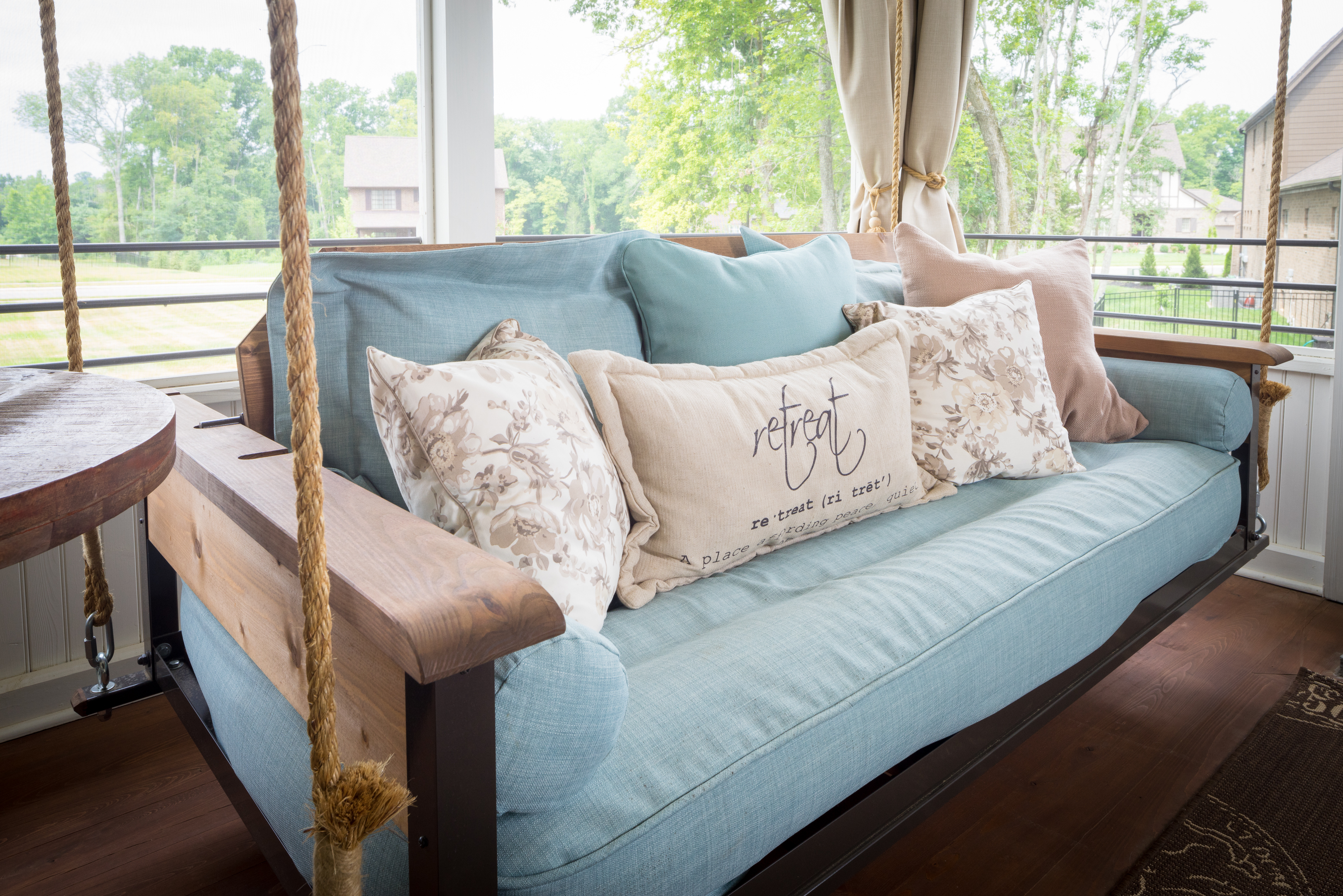 Unique porch swing with cushioning resembling denim