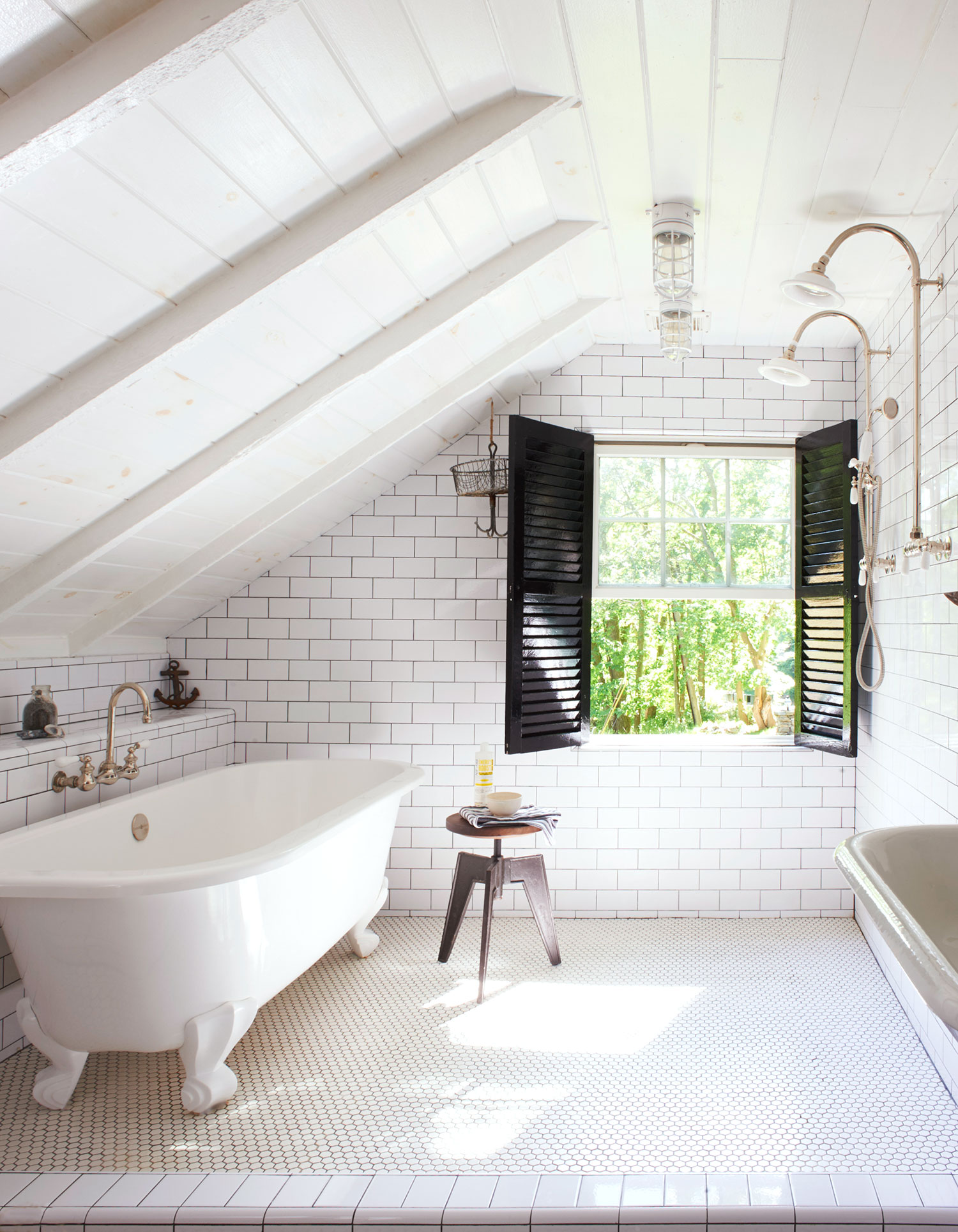 White attic bathroom with black shutters and vintage elements