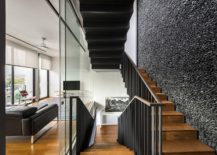Wood-and-metal-staircase-connecting-the-multiple-levels-of-the-contemporary-home-217x155