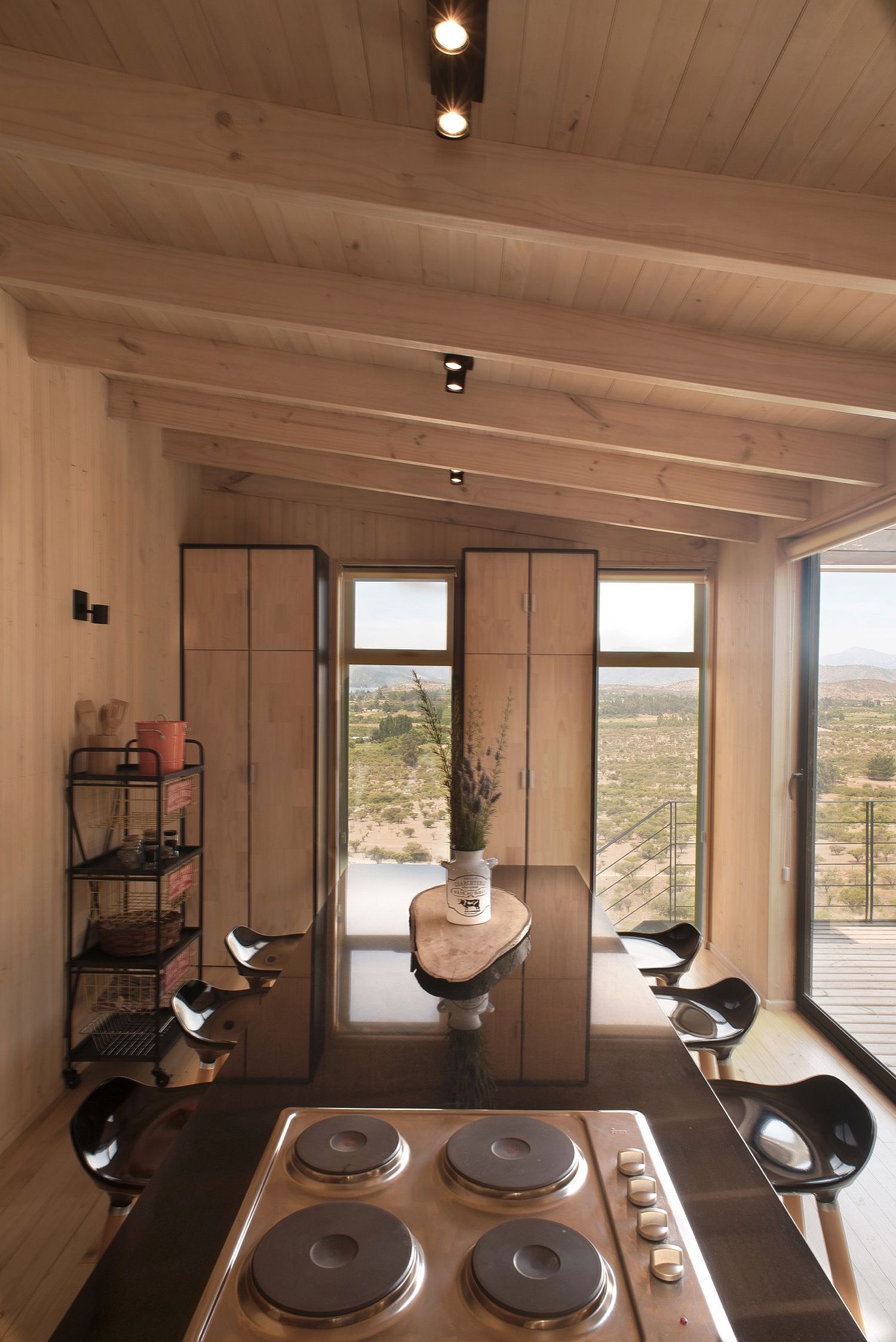 Wooden interior of the budget home in Chile with spacious dining room