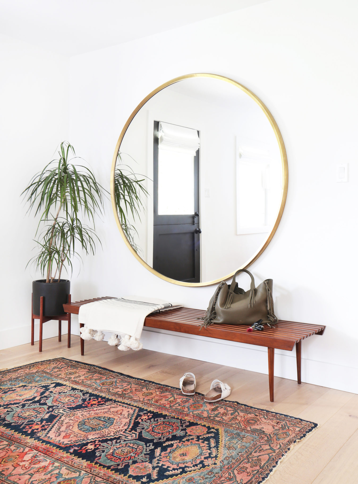 A big mirror opens up the entryway