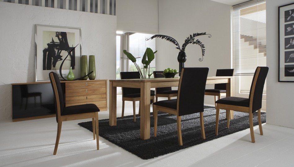 A black rug makes a dining room incredibly stylish