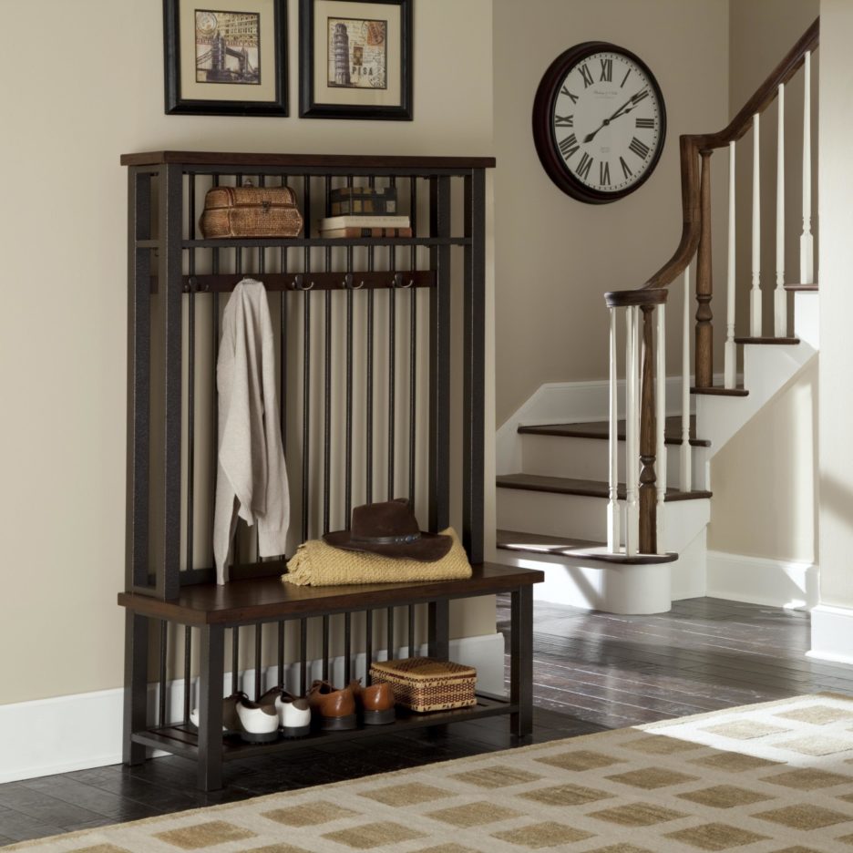 A dark wooden wardrobe in a simple and classic entryway