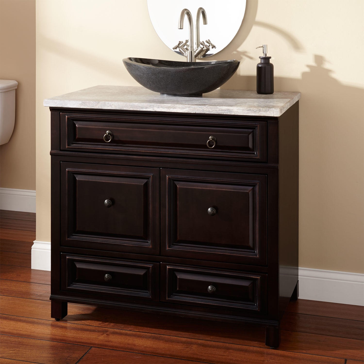 A Darker Vessel Sink Placed On A Wooden Vanity 