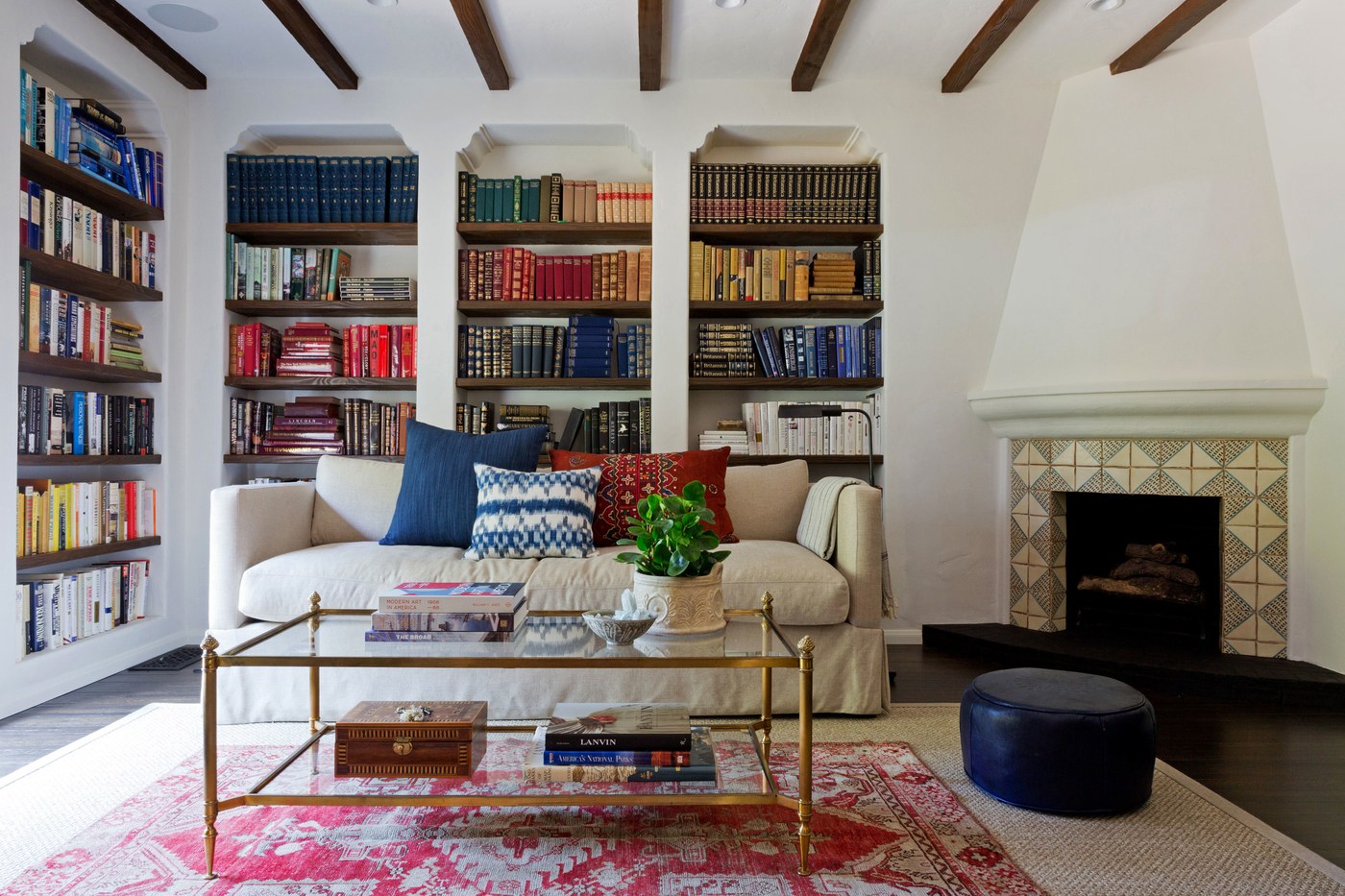 A subtle transparent coffee table in a colorful living room