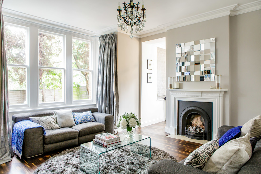 A transparent coffee table blends in and reflects the calming neutral color palette