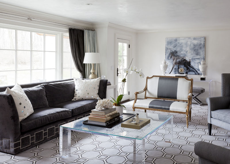 A transparent coffee table is the best choice for a room with a lot of furniture