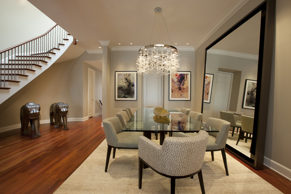 A vast beige rug as a cohesive element in an elegant dining room