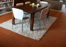 A-white-ruffled-rug-tips-the-scale-in-this-dining-room-217x155