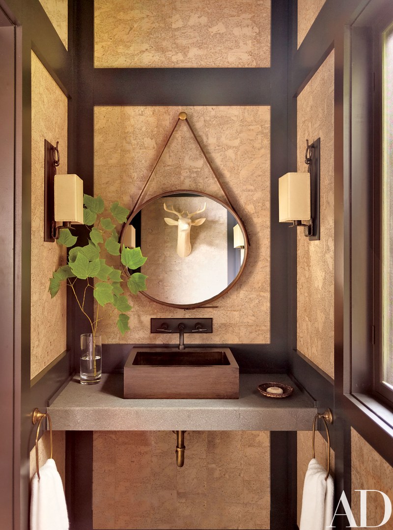 A wooden vessel sink in a country-styled bathroom