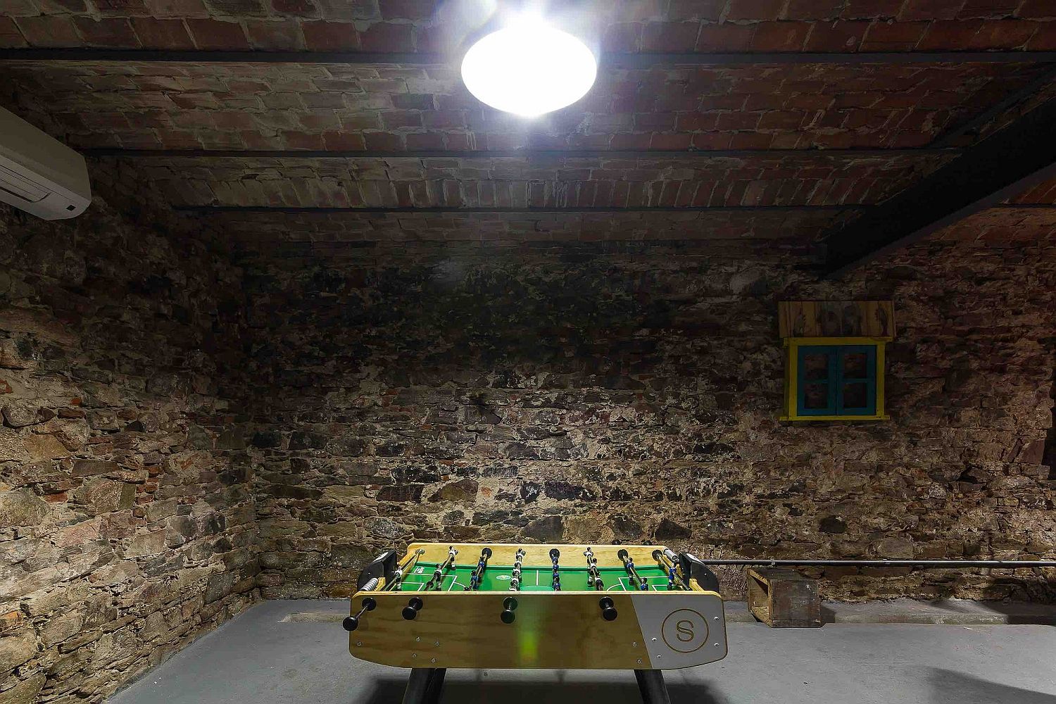 Basement of the industrial office space with recreation zone and playroom