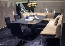 Booth-style-seating-coupled-with-blue-chairs-and-a-dashing-table-in-the-contemporary-dining-room-217x155