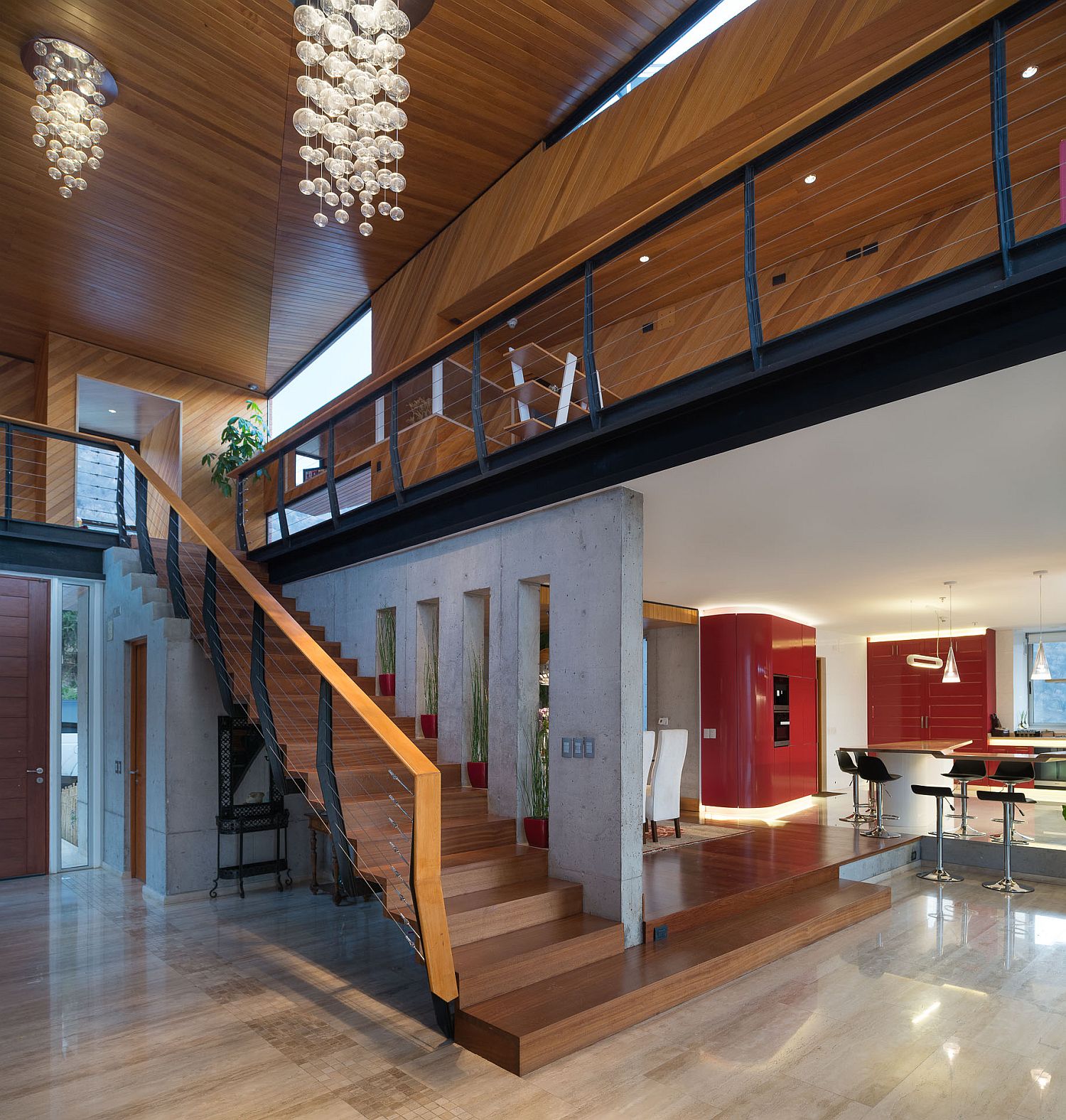 Cascading chandelier illuminates the stairway at Casa Chamisero